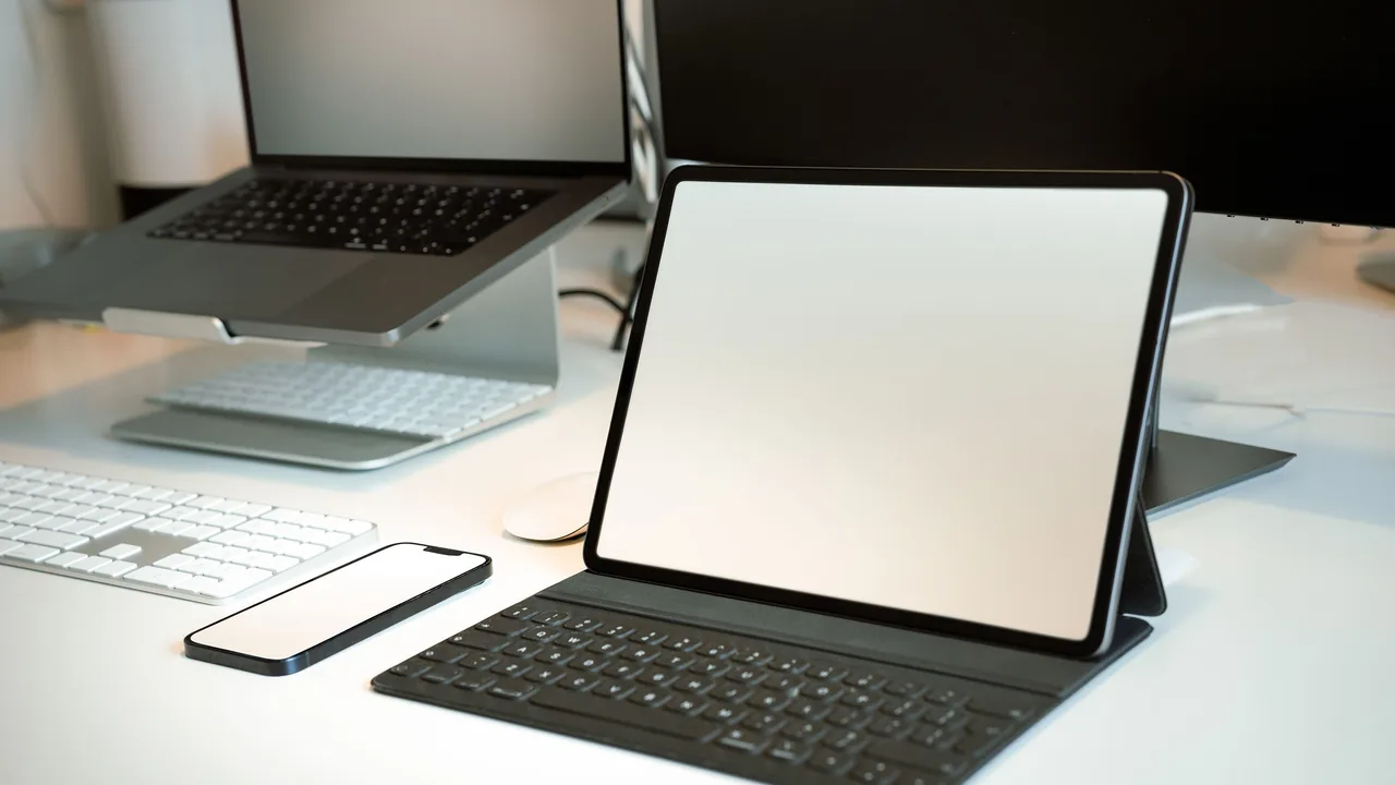 Laptop, tablet, and smartphone workspace