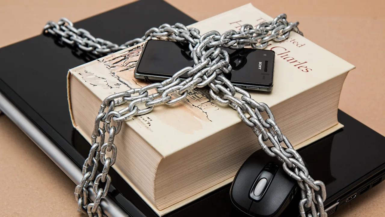 Computer and phone secured with a chain